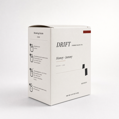 DRIFT tea box front view in black, gold, and cream with seven drip bag sachets